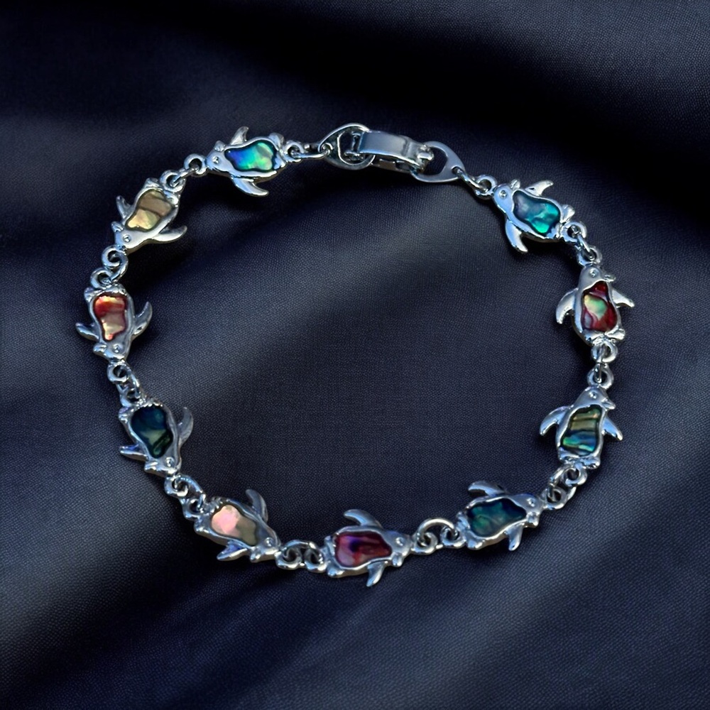 Silver tone abalone penguin link bracelet